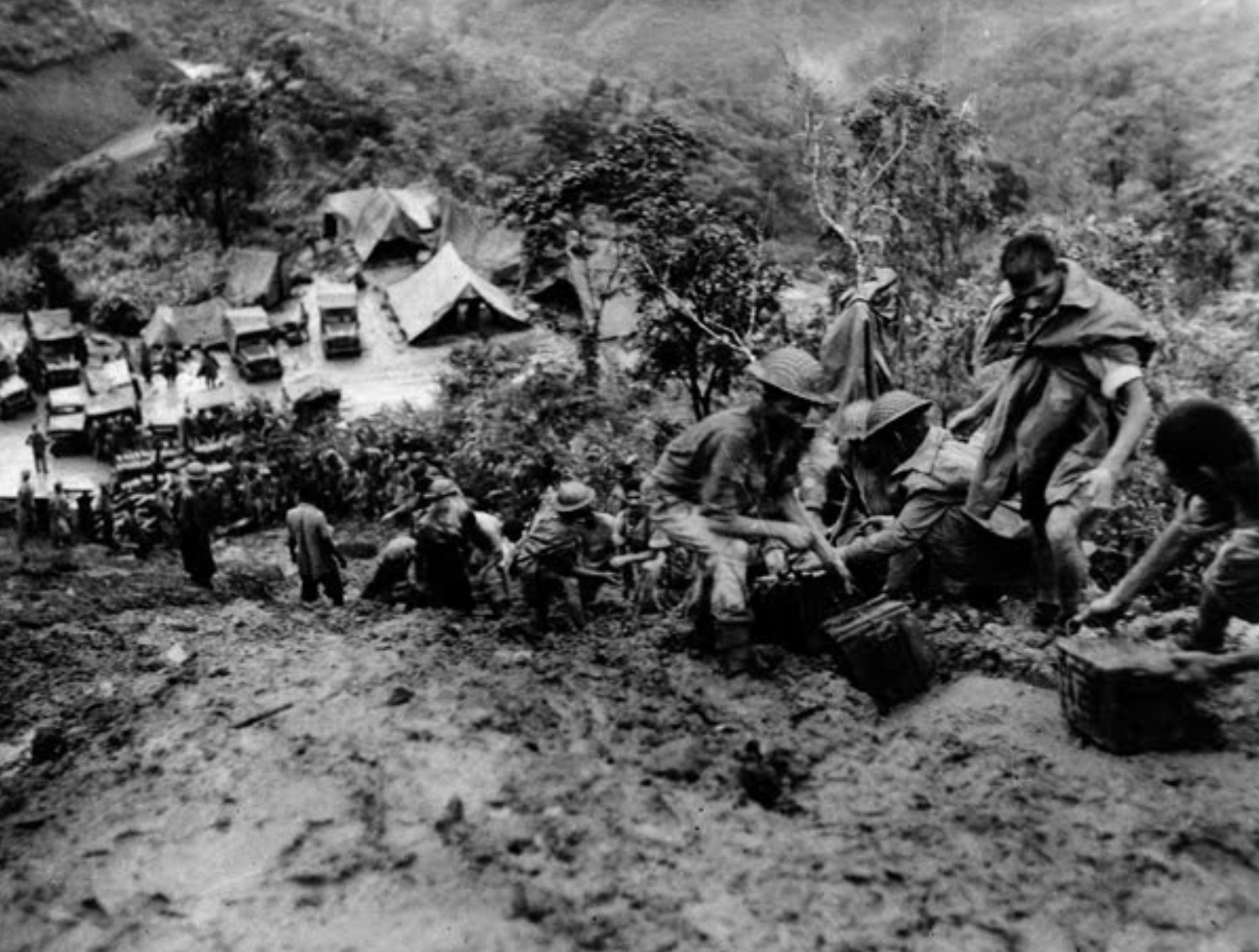 Indian troops move ammunition in very muddy conditions whilst on the road to Tamu.